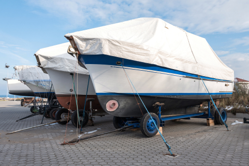 Dry-docked boats stored outdoors